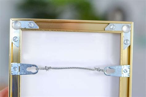 metal brackets with holes in picture frames|metal frame wall hangers.